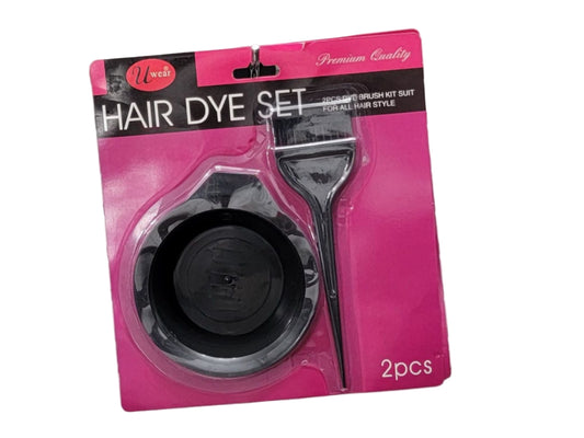 Hair dye set packaging with a pink background on a metallic surface.